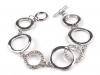 Metal bracelet of rings with strass stones