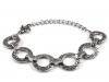 Metal bracelet of rings with spirals