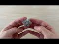 Brooch with rhinestones, snowflake, rotating