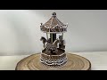 Christmas carousel, illuminated church - gingerbread imitation