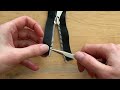 Bottom end cap for repairing a metal two-way zipper
